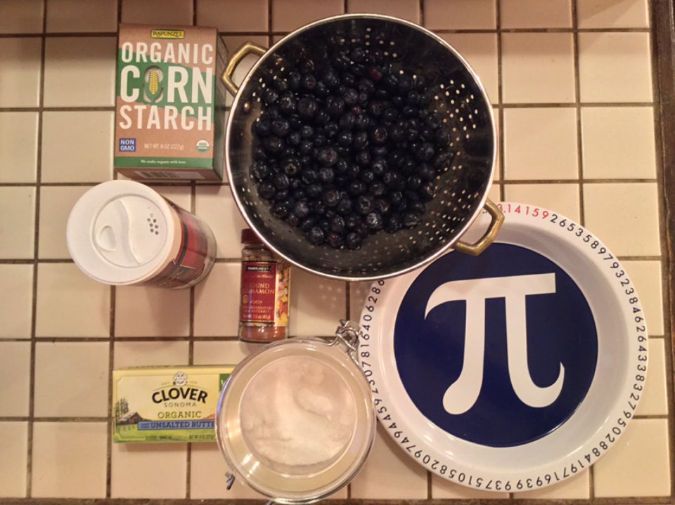 Blueberry pie ingredients, assembled on an off-white tile countertop.