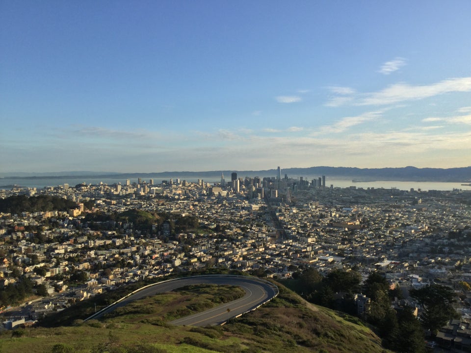 View from Twin Peaks in the morning of East Bay hills, downtown San Francisco, hairpin turn up Twin Peaks boulevard.