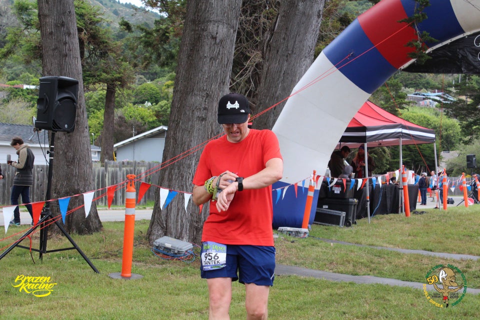 Tantek stopping his running watch just after crossing the Double Dipsea finish line